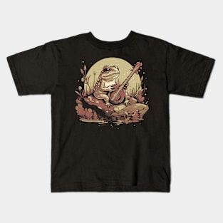 Frog playing the banjo on a rock Kids T-Shirt